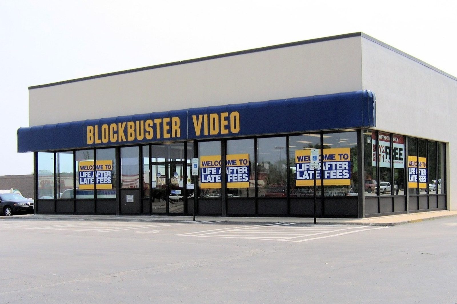 A Blockbuster Video store seen from its car park, blue and yellow signage above the windows