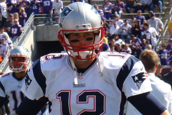 Tom Brady in a New England Patriots uniform, helmet on, before a game