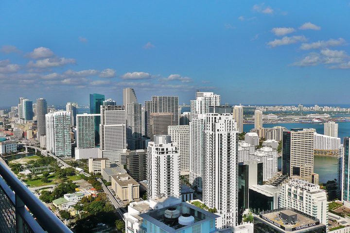 The Brickell district of Miami seen from above, condominium towers running down to the bay