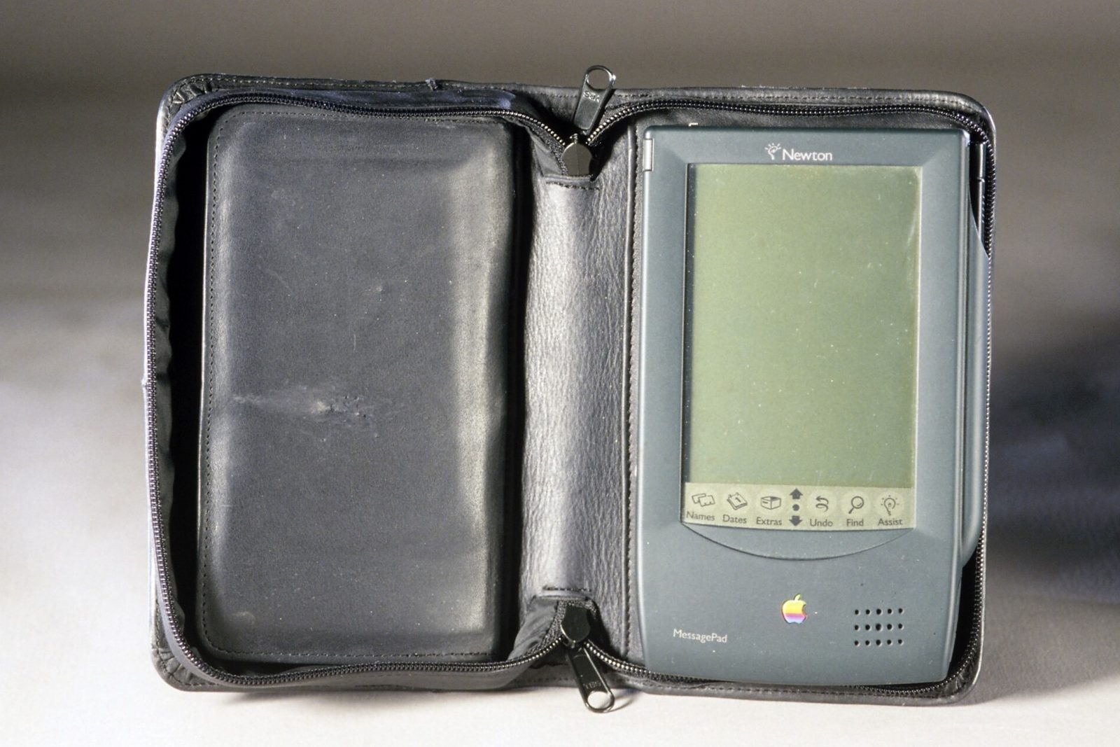 An Apple Newton MessagePad resting in its folding case